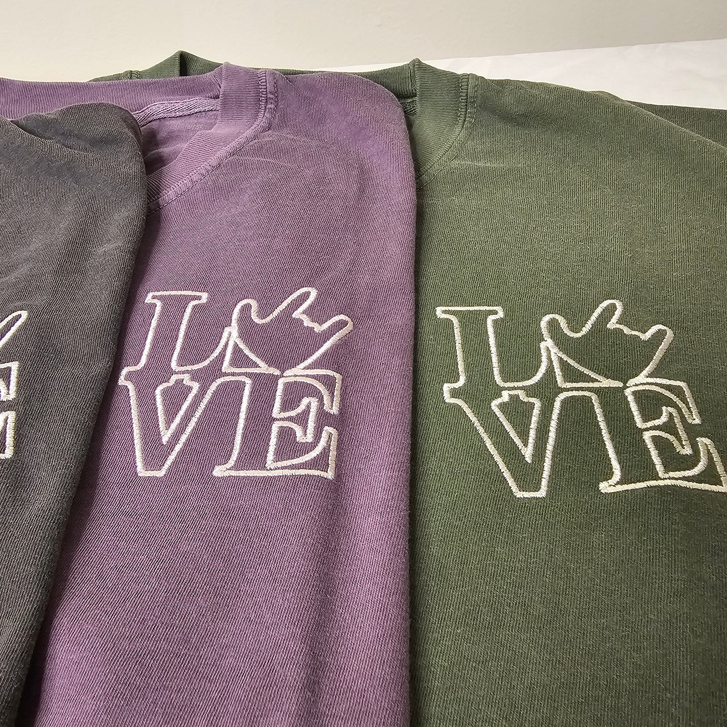 Embroidery - LOVE on left chest.