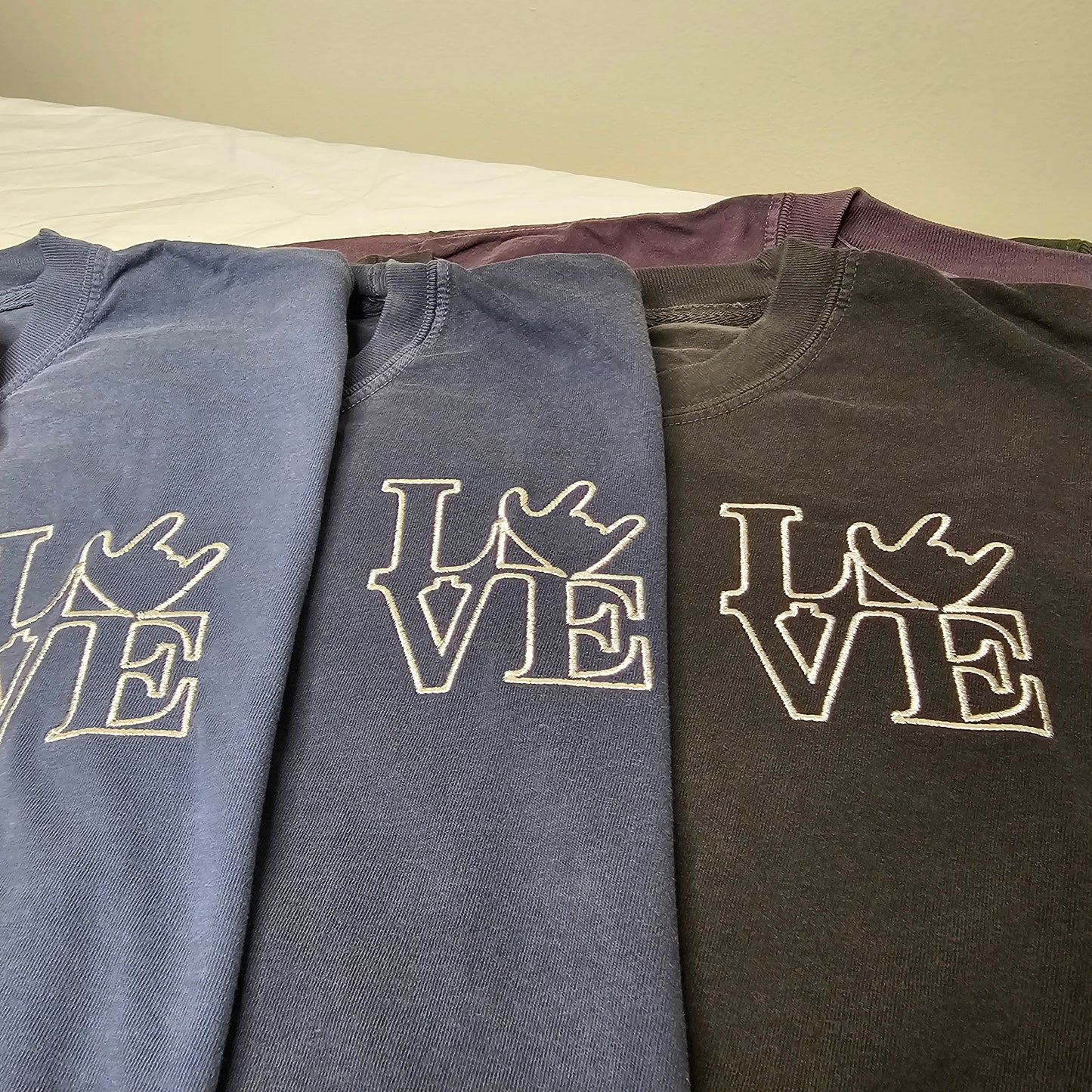 Embroidery - LOVE on left chest.