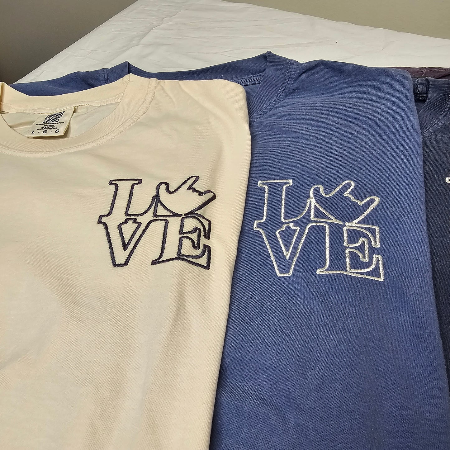 Embroidery - LOVE on left chest.